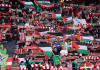 Athletic stands with Palestine