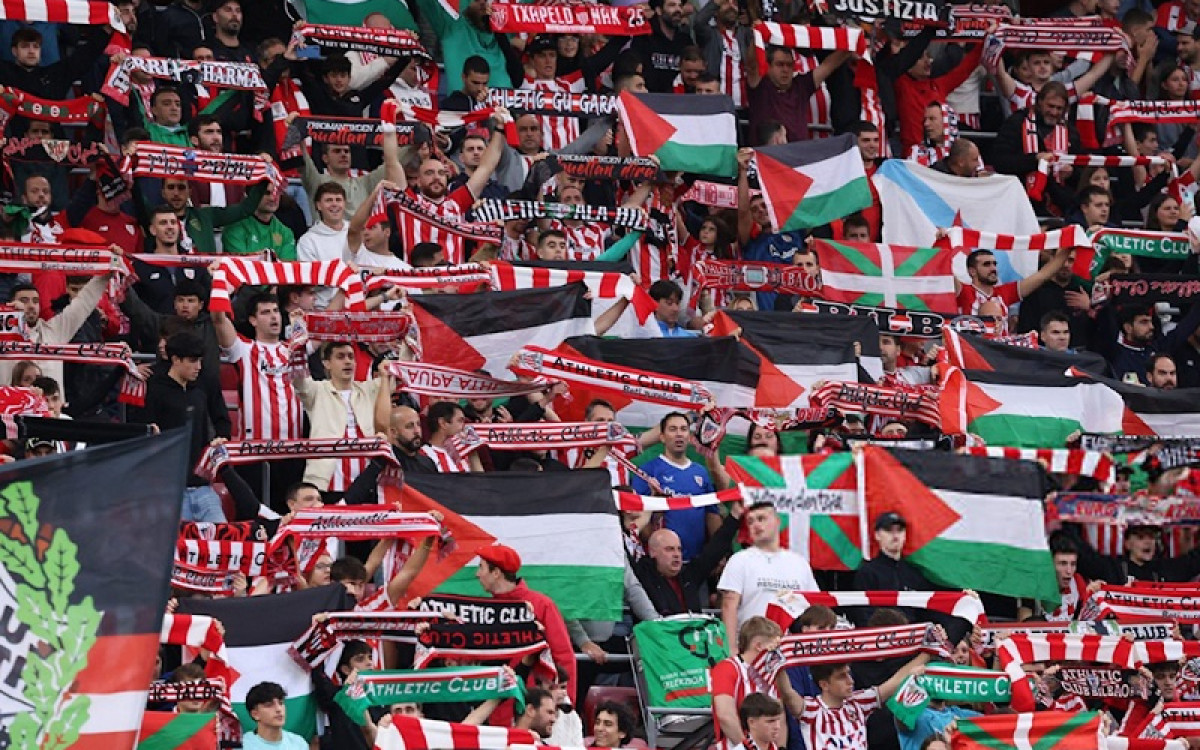 Athletic stands with Palestine